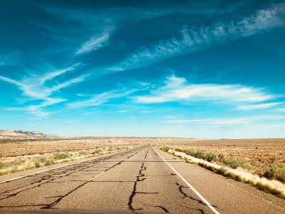 Heading back south. Pavement out here cracks like dry mud and nobody is in a hurry about it.